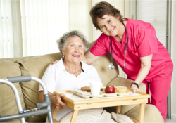caregiver serving food to patient